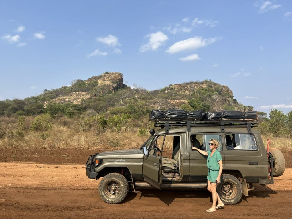 Woman outside car in remote Kenya